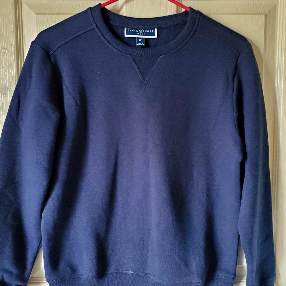 Soft and cozy in fleece, this pullover crewneck top from Karen Scott.